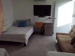 En eller flere senge i et værelse på Casa a 7 min aeropuerto de monterrey