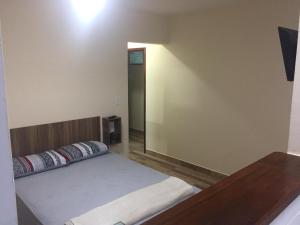 Postel nebo postele na pokoji v ubytování Varandas do Atalaia Suítes