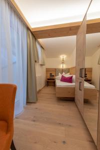 Giường trong phòng chung tại Hotel Garni Glockenstuhl
