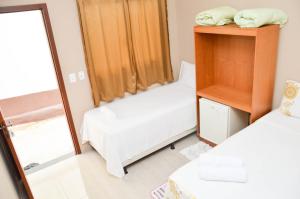 Postel nebo postele na pokoji v ubytování Pousada Pouso Vitoria