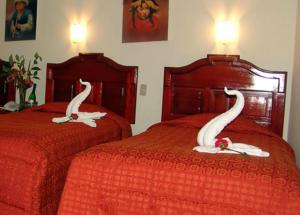 Voodi või voodid majutusasutuse Hotel Inkayra toas
