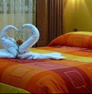 Voodi või voodid majutusasutuse Hotel Inkayra toas