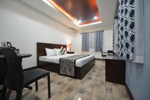 Postel nebo postele na pokoji v ubytování Hotel Gabriella