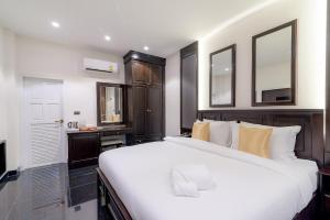 Postel nebo postele na pokoji v ubytování T Villas Hua Hin + 11 fotografií
