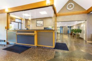 an office lobby with a large window and a counter at Days Inn by Wyndham Lanham Washington DC in Lanham