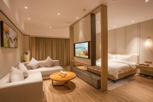 Postel nebo postele na pokoji v ubytování Nanan Ao Sheng Yi Hao Hotel + 37 fotografií