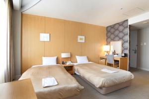 Postelja oz. postelje v sobi nastanitve Hotel Grand Vert Gizan