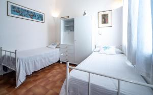 A bed or beds in a room at Villa Mediterranea