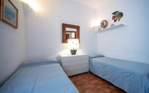 A bed or beds in a room at Villa Mediterranea