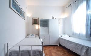 A bed or beds in a room at Villa Mediterranea