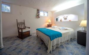 A bed or beds in a room at Villa Mediterranea