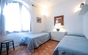 A bed or beds in a room at Villa Mediterranea
