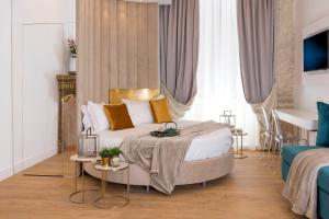 a bedroom with a king sized bed and a table at Navona Style in Rome