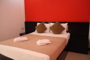 Ліжко або ліжка в номері Suksai Buri Resort