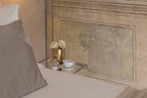 A bed or beds in a room at Navona Style