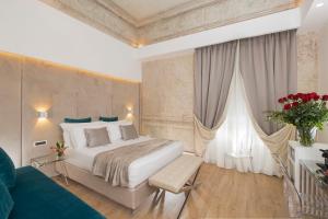 A bed or beds in a room at Navona Style