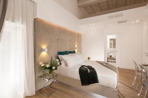 A bed or beds in a room at Navona Style