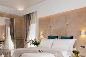 A bed or beds in a room at Navona Style