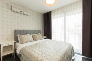 a bedroom with a bed and a window at The Loft House Taksim in Istanbul +31 photos