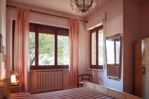 Posteľ alebo postele v izbe v ubytovaní Le Balze Appartamenti