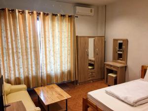 Postel nebo postele na pokoji v ubytování Sakura House
