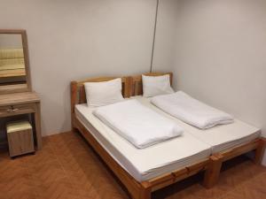 Postel nebo postele na pokoji v ubytování Sakura House
