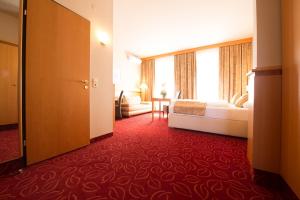 Uma cama ou camas num quarto em Hotel Beethoven