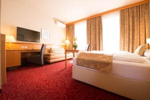 Uma cama ou camas num quarto em Hotel Beethoven