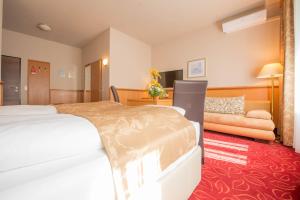 Uma cama ou camas num quarto em Hotel Beethoven