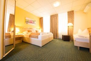 Uma cama ou camas num quarto em Hotel Beethoven