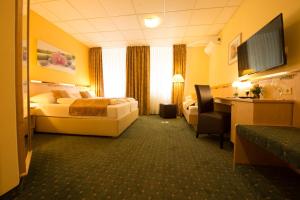 Uma cama ou camas num quarto em Hotel Beethoven