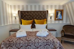 a bedroom with a bed with two pillows on it at Europa Hotel Kühlungsborn in Kühlungsborn