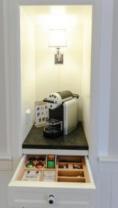 a small kitchen with a counter with a appliance on it at Europa Hotel Kühlungsborn in Kühlungsborn