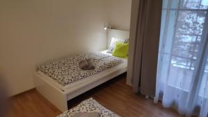 Posteľ alebo postele v izbe v ubytovaní Apartman 404