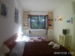 Postel nebo postele na pokoji v ubytování La casa di Nataly