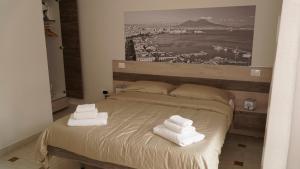 Ein Bett oder Betten in einem Zimmer der Unterkunft Donna Vicenza Bed & Breakfast