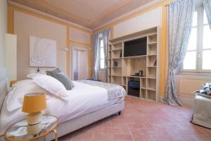 Un pat sau paturi într-o cameră la B&B Villa Costanza