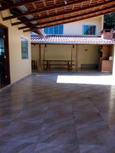 an empty patio with a table in a building at Residencial Di Paoli in Bombinhas