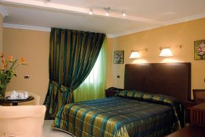 Postel nebo postele na pokoji v ubytování Hotel Palma