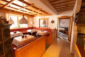 a restaurant with two tables in a room at Kur- und Ferienhotel Haser in Oberstaufen +127 photos