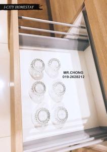 a set of plates on display in a glass display case at I-City Shah Alam @Home 1 in Shah Alam