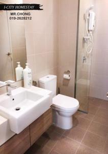 a bathroom with a sink and a toilet and a shower at I-City Shah Alam @Home 1 in Shah Alam