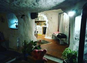a living room with a bear in the middle of a room at Casa Sulla Rupe in Calcata