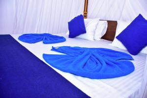 Letto o letti in una camera di Ocean Gate Villa Tangalle