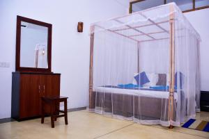 Letto o letti in una camera di Ocean Gate Villa Tangalle