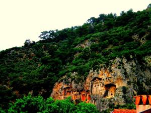 a mountain with a building on the side of it at Dalyan Terrace Hotel in Dalyan