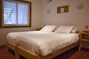 Postel nebo postele na pokoji v ubytování Innata Casa Hostal + 12 fotografií