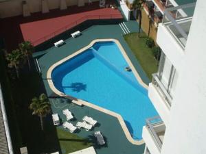 an overhead view of a swimming pool in a building at Peninsula in Punta del Este