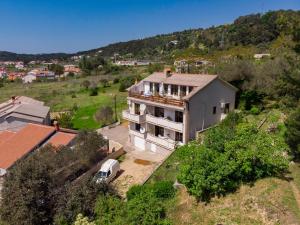 an aerial view of a house in a field at Apartmani Mia in Palit