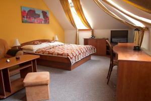 Ένα ή περισσότερα κρεβάτια σε δωμάτιο στο Hotel Pod Hradom
